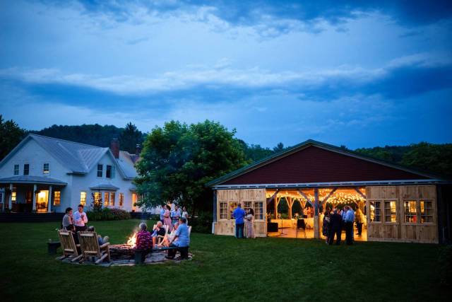 The barn and firepit at dusk at Lareau Farm Inn in Vermont